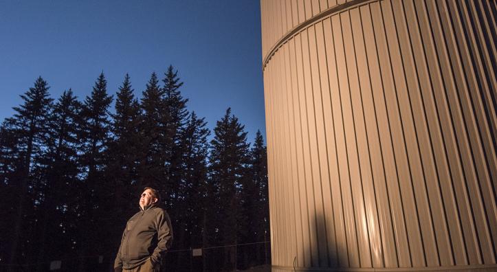 Father Paul Gabor, S.J., the vice director of the Vatican Observatory Research Group, looks to the heavens outside the Vatican Advanced Technology Telescope (VATT) building. Gabor calls the observatory atop Mount Graham “a very standard scientific institution.” | Bill Hatcher