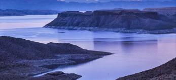 A dirt road winds toward Gregg's Hideout, a remote bay on Lake Mead, at sunset. | Larry Lindahl