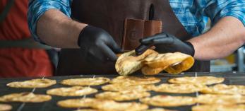 Christopher Hudson demonstrates the fine art of tortilla making by Jeff Kida