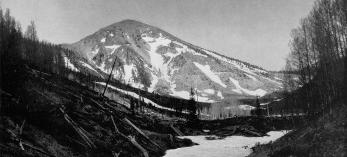 Snow covers a streambed in the Inner Basin of the San Francisco Peaks. “A pipeline beneath the white mantle supplies the Flagstaff reservoir,” Arizona Highways reported in 1936. By Norman G. Wallace