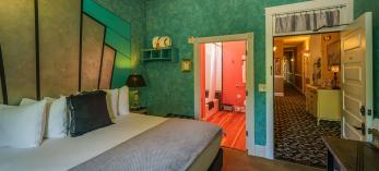 A room at the Grand Highland Hotel with view of bathroom and outside hallway. By Laurence Parent