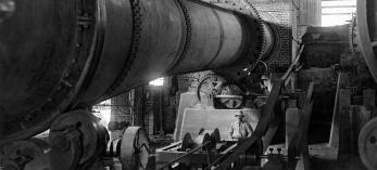 An unidentified man poses in a cement plant at the site of Theodore Roosevelt Dam in a Walter J. Lubken photo from March 1905. The dam was completed six years later, creating Theodore Roosevelt Lake.