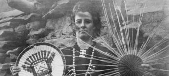 Elizabeth Compton Hegemann poses with two kachina plaques, one completed and one in progress, at the Hopi village of Oraibi in 1927. | Elizabeth Compton Hegemann