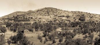 Multiple buildings are visible in this photo from Mowry’s mining heyday. Courtesy of U.S. Geological Survey