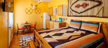 The Nopales Suite (pictured) is a one-bedroom, one-bathroom apartment with a kitchenette and western décor. By Steven Meckler