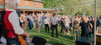 Revelers enjoy live music at a wine tasting event