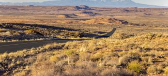 The Tse’nikani Scenic Road, a stretch of U.S. Route 191, curves through the expansive landscape of the Navajo Nation. By John Burcham