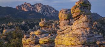 Cochise Head looms over the hoodoos along Chiricahua National Monument’s Heart of Rocks Loop at sunset. | Laurence Parent