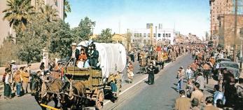 Tucson residents line one of the city’s streets during a Tucson Rodeo parade in the 1950s. | Arizona Highways Archives