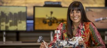 Meenakshi Wadhwa poses with a scaled down model of an extraterrestrial land rover. By Paul Markow