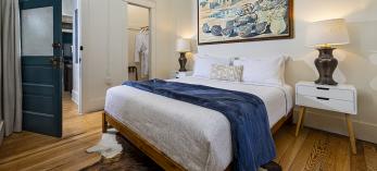 A room at the Warner Hotel features hardwood floors, a cowskin rug and complimentary robes in a closet. By Steven Meckler