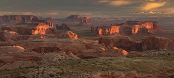 Sandstone buttes reach skyward in the Navajo Nation’s Monument Valley, as viewed from Hunts Mesa. | Derek von Briesen