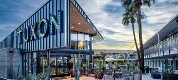 Photograph of The Tuxon Hotel entrance is by Steven Meckler.