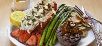 Photograph of lobster tail and steak with asparagus at The Copper Note is by Karen Shell