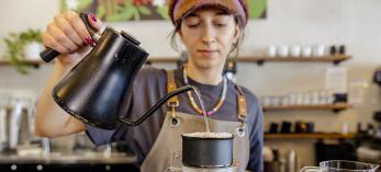 Barista Linnea Renken prepares a pour-over coffee at Peixoto’s Chandler location. | Jill Richards