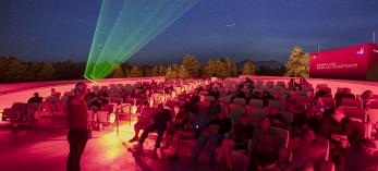 A presenter guides visitors on a tour of the night sky at Lowell Observatory. By Dawn Kish