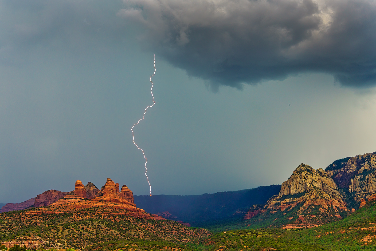 Photo by Robert Shuman  |  Lightning strike on the rim with a rare fire that the lightning caused