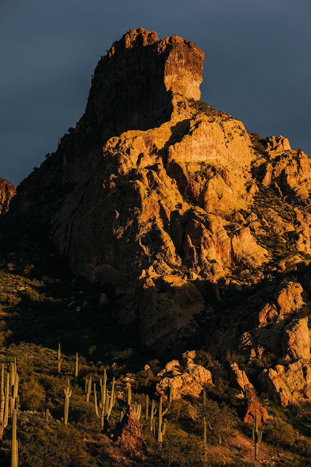 Photo by Diana Lustig  |  The sun setting creates dramatic shadows on the mountains in the Salt River area.