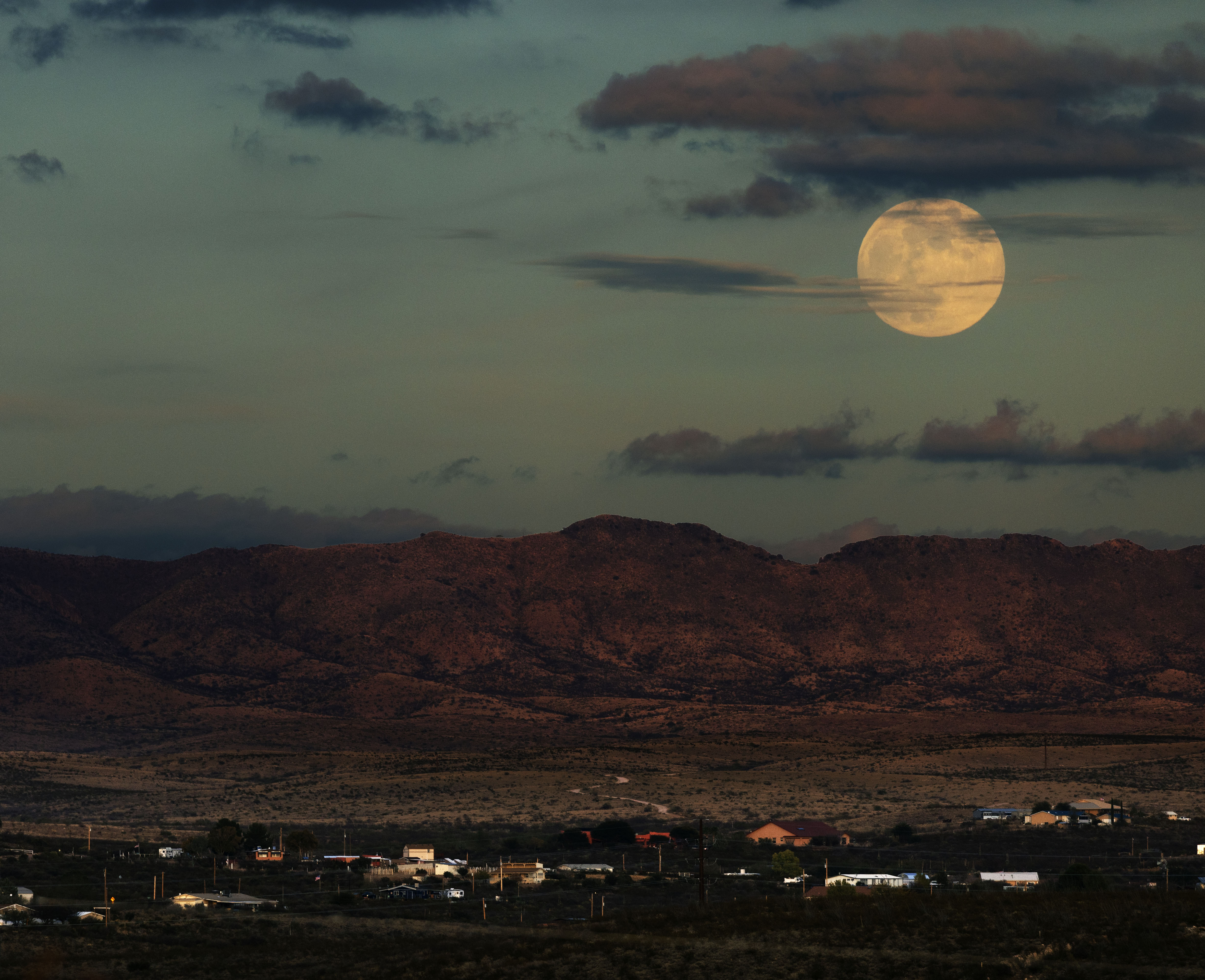 Photo by William Jason Lassiter  |  Full moon rise over the town of Tombstone.