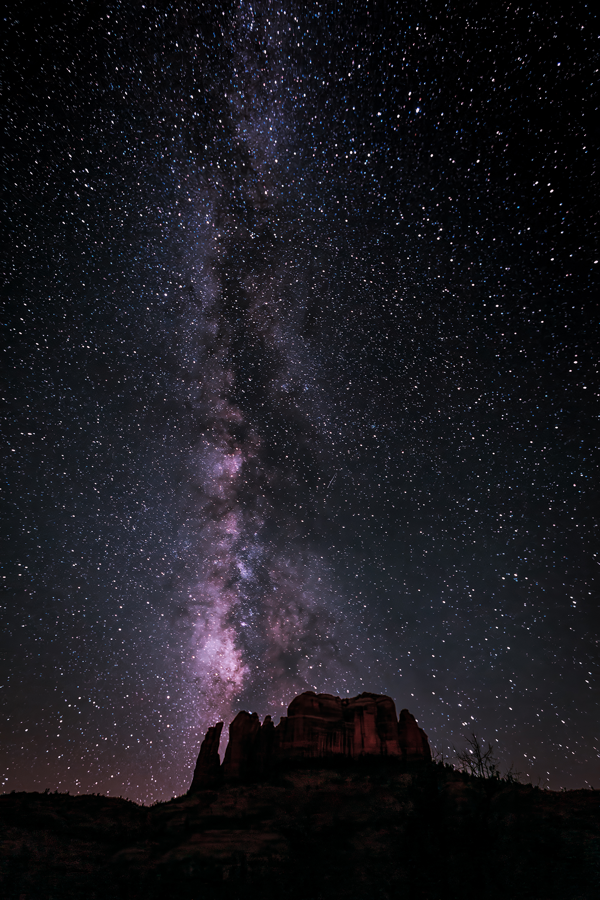 Photo by Susie Reed  |  In the fall the Milky Way is vertical in the sky. Here it is above Cathedral Rock.