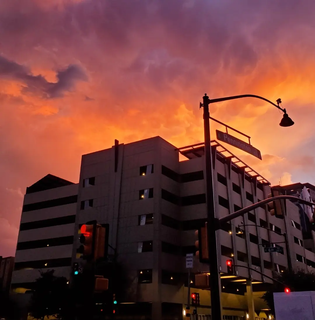Photo by Grace Shepard  |  One of many gorgeous and vibrant Arizona sunsets, showcased in Downtown Tucson overhead of the city